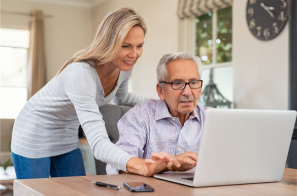 Senior holding a Medicare card